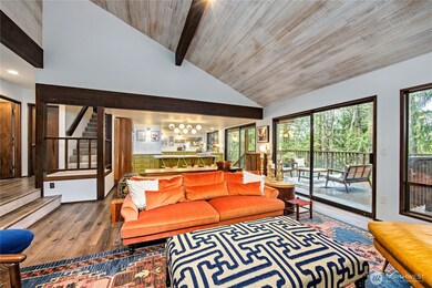 Open to the newly remodeled kitchen. There is also a bedroom, full bath and laundry on main level.