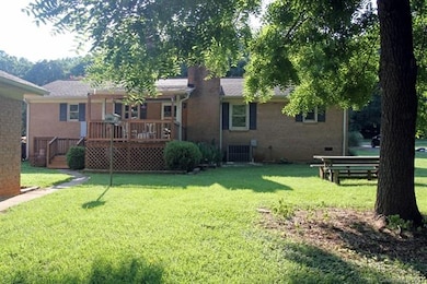 Large backyard with covered porch & 1 car garage c
