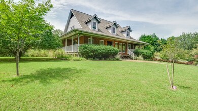Side porch off master suite and open private yard with trees galore.