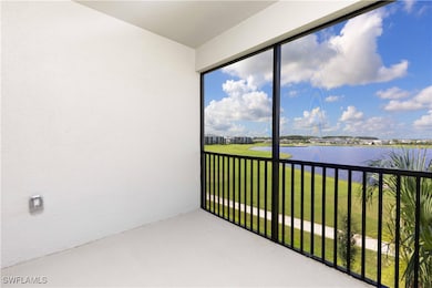 Balcony of corner unit featuring a tranquil water