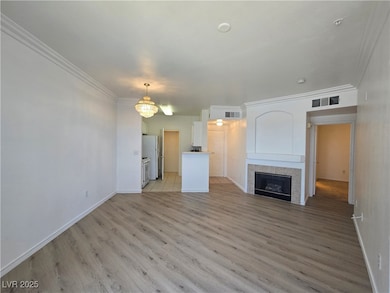 Unfurnished living room featuring light wood finis
