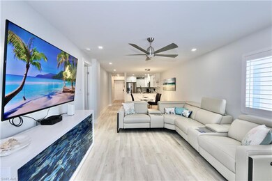 Living room featuring light wood-type flooring, ce