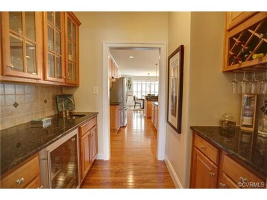 Butler's pantry with wet bar and beverage refriger