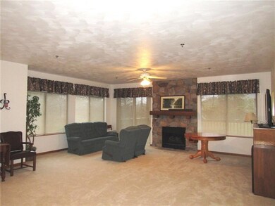 To the back of the couches is a sliding glass door