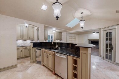 Kitchen with pendant lighting, vaulted ceiling wit
