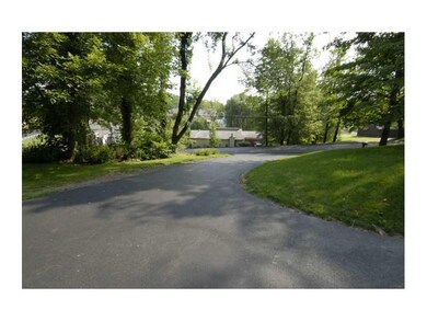 Exterior Front. Driveway looking down to the stree
