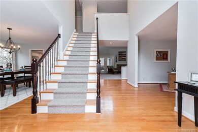 The entrance is flanked by the dining room and liv