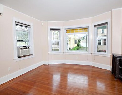 Living Room. note hardwoods, out bay windo to porc