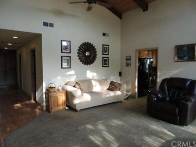 Living room w/ view down hall