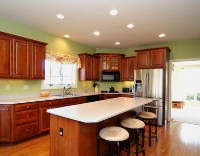 Kitchen. The cheerful kitchen features cherry cabi