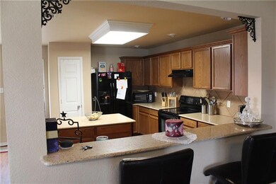 Breakfast Bar with open floorplan to Living room