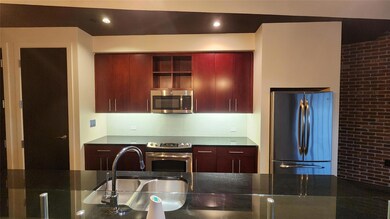 Kitchen with appliances with stainless steel finis