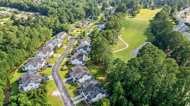 View of property location with nearby suburban area