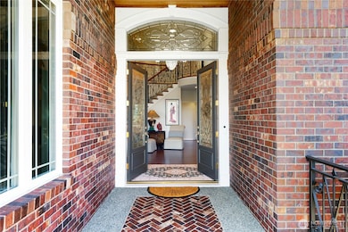 Beautiful leaded glass doors lead into magnificent entry.