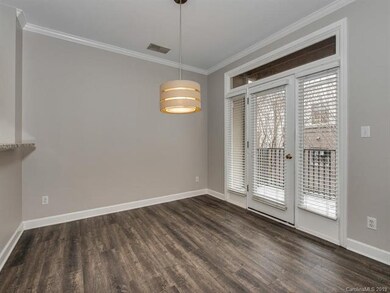 DINING AREA THAT LEADS TO COVERED PORCH