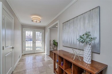 Full light glass double door entry with tiled floo
