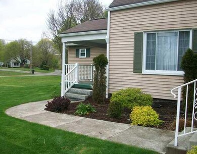 Exterior Front. Professionally landscaped