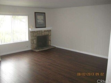 Large living room with fireplace and new wood lami