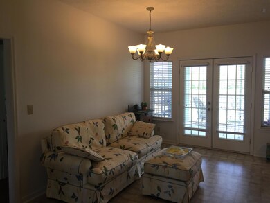 Dining currently being used as an extra sitting area to enjoy all the natural lighting