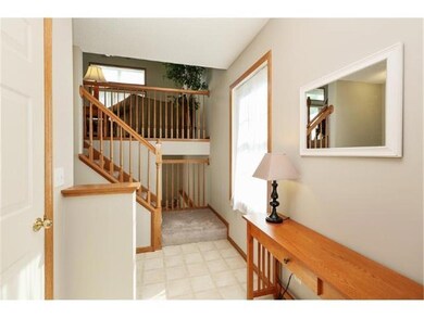 Large foyer with entry closet. Railings open up to