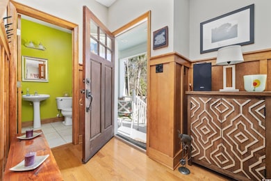 Entryway with light wood finished floors