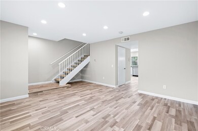 Livingroom and staircase leading to upstairs