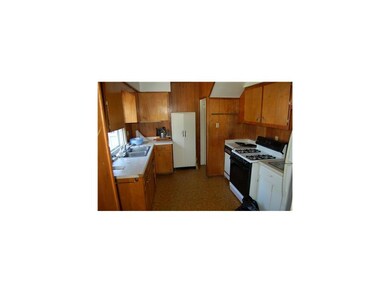 Kitchen. Lots of potential since sized well. Stair
