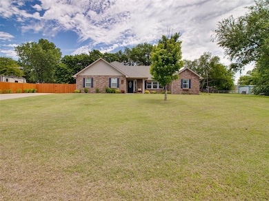 Ranch-style home featuring brick siding