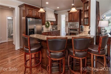 Hardwoods and Custom Cabinets Throughout