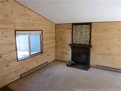Living Room. Snuggle to a cozy wood fire in the li