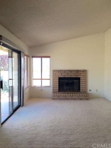 The den off the kitchen...with a cozy fireplace an