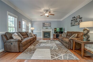 Great room has a gas fireplace and beautiful moldi