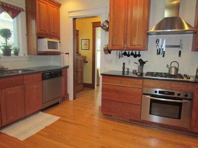 Kitchen Cherry Cabinetry ~ Stainless appliances