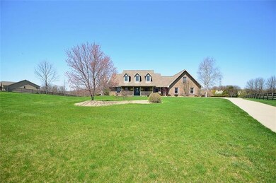 Nestled on a 2.57 sprawling lawn fenced acre lot t