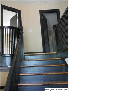 Looking upstairs from the landing of the staircase