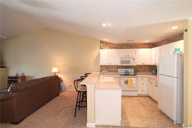 Open floor plan with vaulted ceilings.