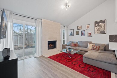 Living area with high vaulted ceiling, a tile fir