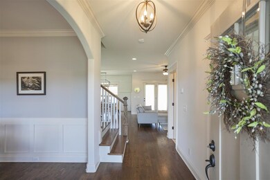 The foyer, with its high ceilings and elegant ligh