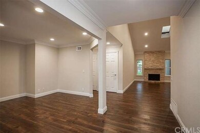 View from entry of dining room and custom living r