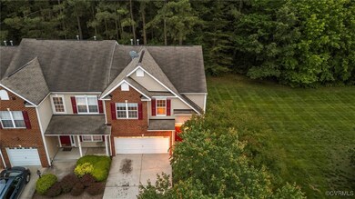 View of front of house with driveway, an attached