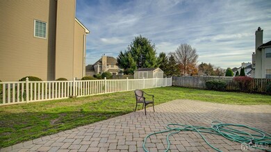 Large paver patio, fenced in on 2 sides.