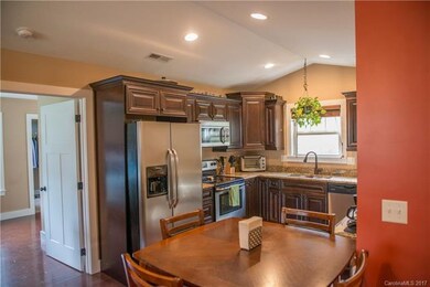 Vaulted ceiling and canned-lights in the kitchen a