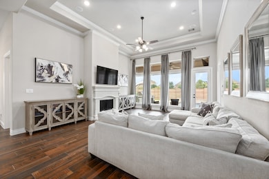 The family room features a cast stone fireplace an