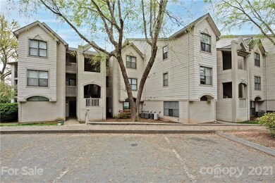 Exterior front of 2 bedroom, 2 bath, main level condo located in the heart of Cornelius with lake access & plenty of community features!