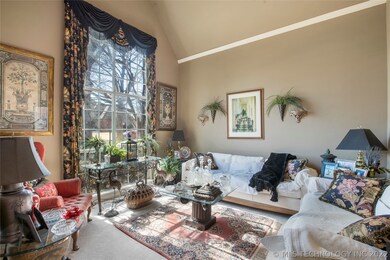 Vaulted formal living room with a large picture wi