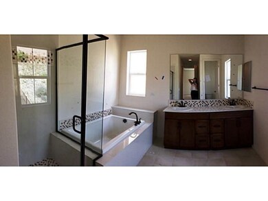 Luxurious master bath w separate tub/shower and lots of storage