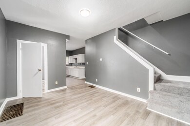 Living Room View + Stairs View