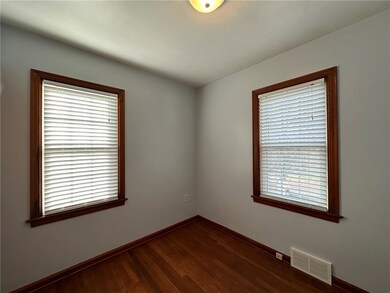Another bedroom with hardwood floors and large clo