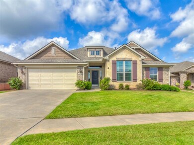 Craftsman-style home with a front yard and a garag