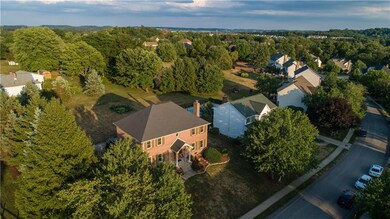A newer 30 year shingle roof.  A nice covered porch and beautiful landscaping and trees offering privacy.